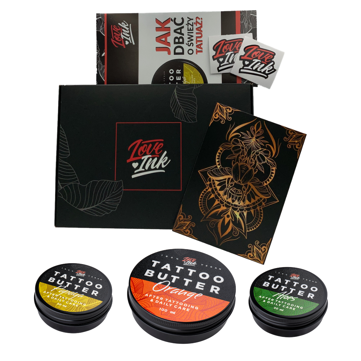 Dárková sada Love Ink Tattoo Butter 100 ml s jasně označenými plechovkami: žlutá plechovka Tattoo Butter Papaya, zelená plechovka Tattoo Butter Aloe a oranžová plechovka Tattoo Butter Orange, uložená v elegantní černé krabičce se zlatými akcenty.