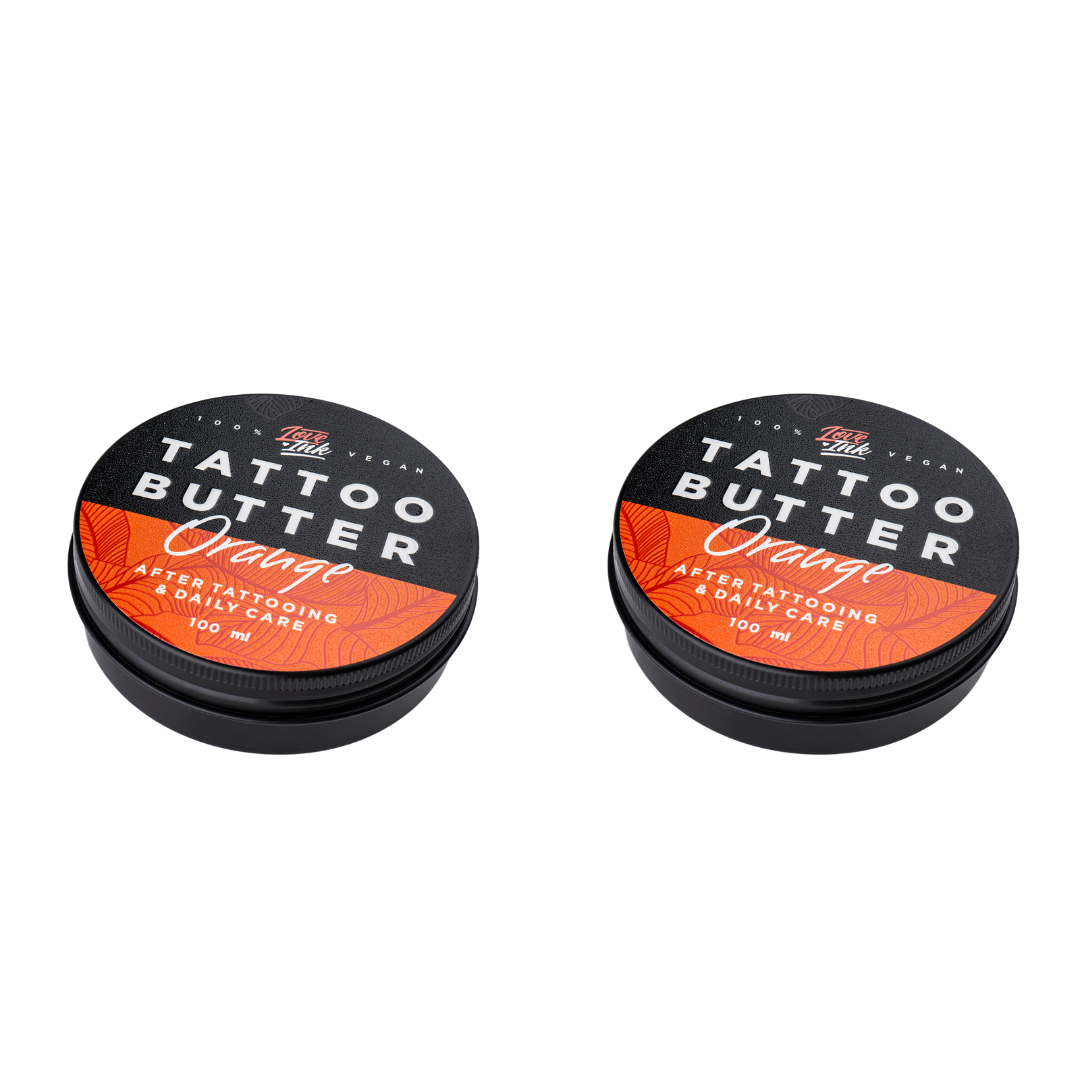 dvě balení Tattoo Butter Orange s oranžovou etiketou.